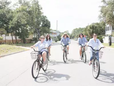 A group of five riding bikes